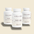 CELLSHE Cellular Trio: NAD+, NMN 500, and Resveratrol 600 supplement bottles on a cream background