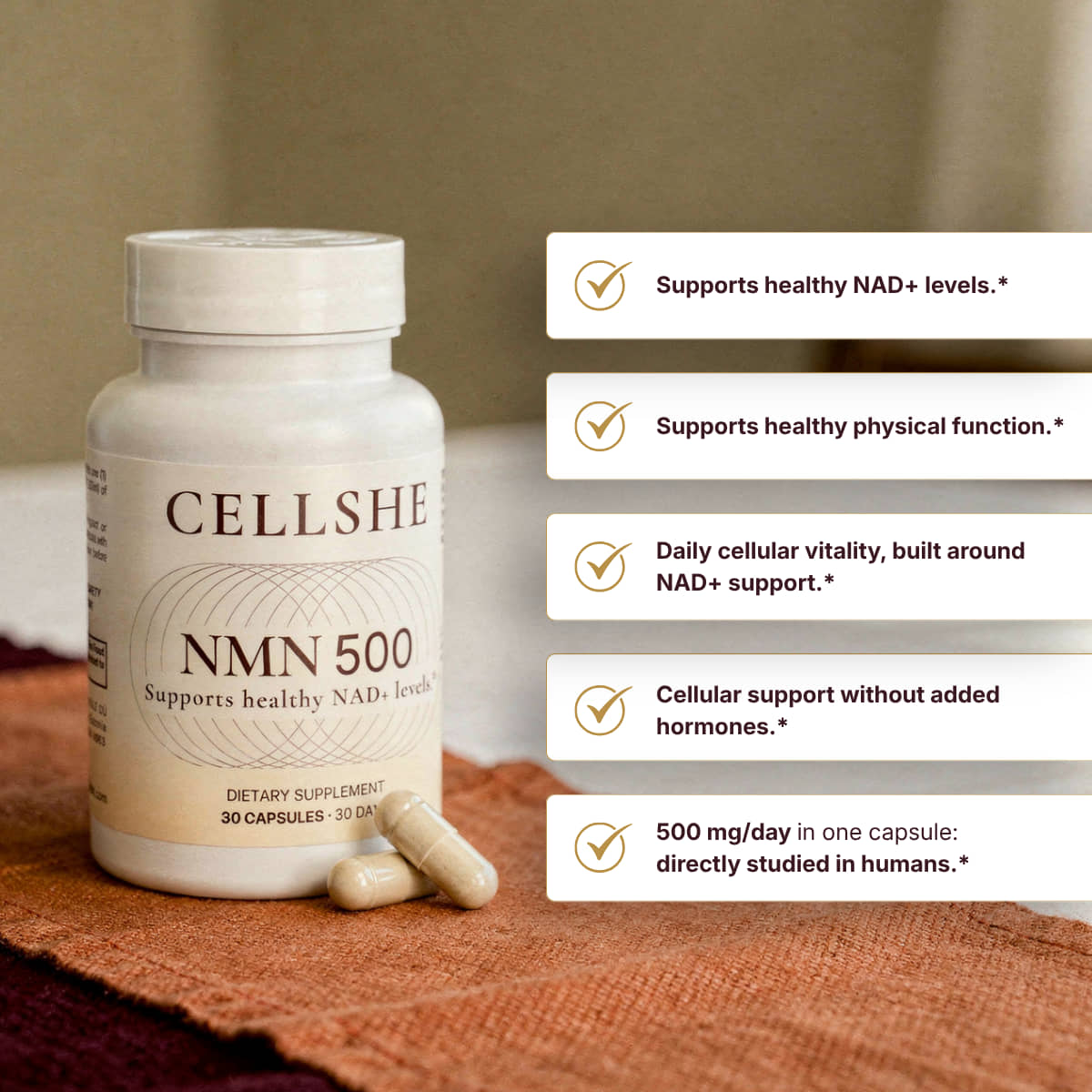 CELLSHE NMN 500 bottle with two capsules on rust linen, beside a list of product benefit callouts